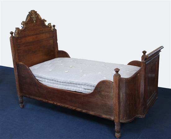 A 19th century Continental parcel gilt pine bateau a lit, W.3ft 2in. L.6ft 6in. headboard H.4ft 11in.